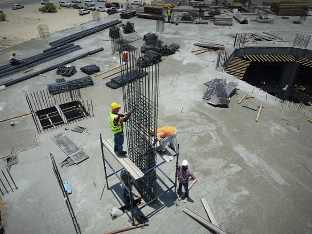 Workers on a commercial concrete construction site